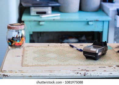 Credit Card Machine For Transaction, Buy And Sell Product And Service On Digital Shopping, On Vintage Table With Candy Jar