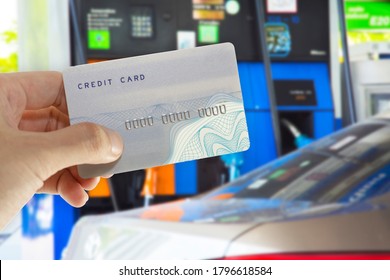 Credit Card With Mobile Phone To Make A Payment For Refueling Car On Gas Station