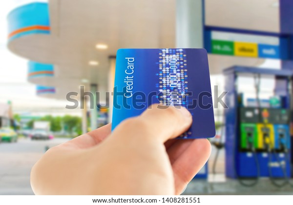 Credit card with mobile phone to make a payment\
for refueling car on gas\
station