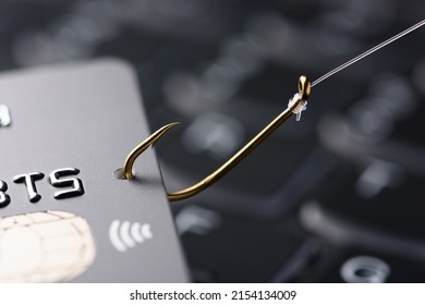 Credit card on fishing hook, phishing scam concept
