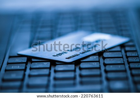 Credit card on keyboard. Online banking.