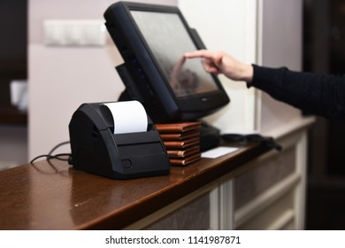 Credit Card Payment And Bill For Purchase. Electronic Finance And Shopping Concept. Cash Counter And Cashier Machine On Table In Restaurant. Casier Using Cash Counter To Enter Sum Near Bill Machine