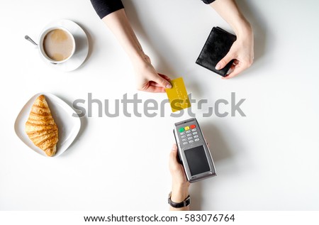 Credit card payment for business lunch on white table top view