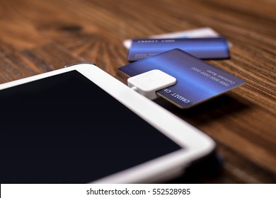 Credit Card Payment On A Swipe Or Chip Reader App On A Tablet Used By Small Or Online Businesses.  The Electronic Device Is Used As A Modern Cash Register Or For Banking.