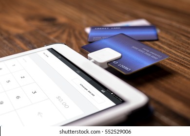 Credit Card Payment On A Swipe Or Chip Reader App On A Tablet Used By Small Or Online Businesses.  The Electronic Device Is Used As A Modern Cash Register Or For Banking.