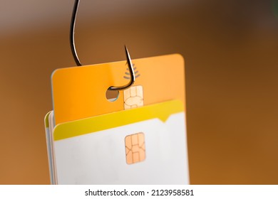 Credit Card Phishing - Piles Of Credit Cards With A Fish Hook