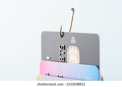 Credit card phishing scam concept. Credit card data theft, card hooked by hacker cyber criminal on fishing hook. - Shutterstock ID 2153038815