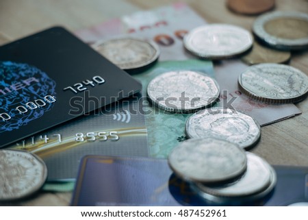 Credit card,  plastic money, put on smartphone and bank note. Electronic money and ewallet concept, new payable in Fintech era.