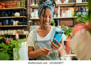 Credit card, pos payment or florist woman, startup small business owner or manager with retail sales product. Commerce shopping service, flower store or African worker with financial fintech purchase - Powered by Shutterstock