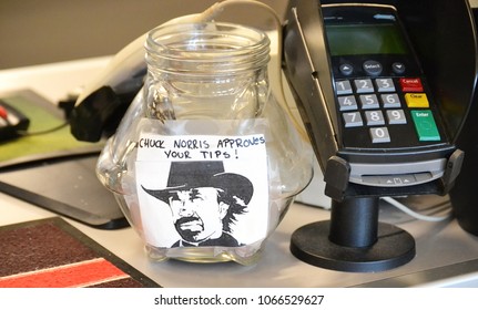 Credit Card Reader And A Tip Jar With A Picture Of Chuck Norris On The Cafeteria Desk. Chuck Norris Approves Your Tips! Turku, Finland-10-12-2013