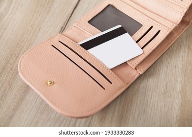 Credit card in wallet, on a wooden background. - Shutterstock ID 1933330283
