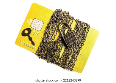 Credit Card Wrapped With Chain And Secured With A Massive Padlock And A Key Isolated On White Background. Creative Financial Security And Fraud Protection Concept.