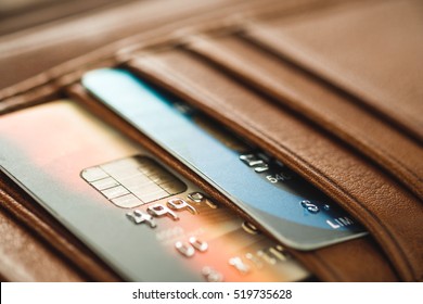 Credit cards in brown wallet in shallow focus - Shutterstock ID 519735628