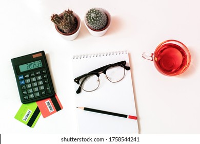 credit cards, calculater, notbook pen and glasses on the desk, online shopping, account and saving concept.