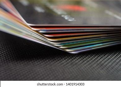 Credit Cards Are Displayed By A Fan On A Black Background.