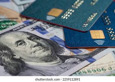 Credit cards and dollars in cash close up.