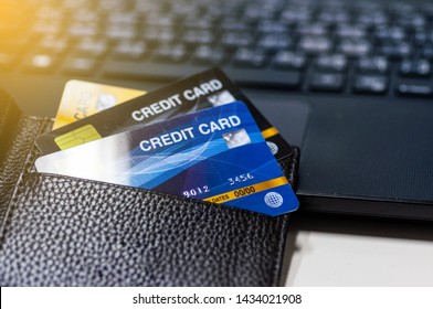 Credit Cards In Leather Wallet On Laptop.  Business Techology Do Moneyless Transaction By Plastic Cards For Buy Sell Offline And Online Shopping.