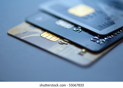  credit cards on a blue background, selective focus. closeup.