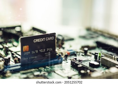 Credit cards on the circuit board, symbols, technology, the use of cryptocurrencies.