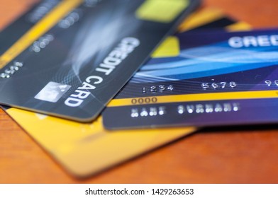 Credit Cards On Table.  Business Techology Do Moneyless Transaction By Plastic Cards For Buy Sell Offline And Online Shopping.