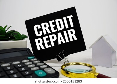 Credit Repair text message with house model, calculator and magnifying glass on wooden background
