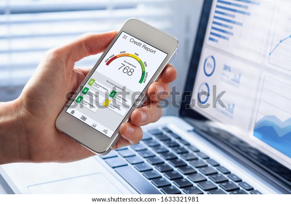 Credit Report with Score rating app on\
smartphone screen showing creditworthiness of a person for loan and\
mortgage application based on payment history and debt usage,\
budget management\
performance
