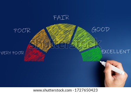 credit score concept, male hand draws a chart with credit history values.