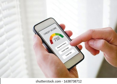 credit score concept on the screen of smart phone, checking payment history and ranking in bank online - Shutterstock ID 1638738712