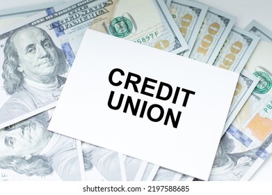 Credit Union The Inscription On The Card On The Background Of Dollar Bills On The Table, Business And Finance