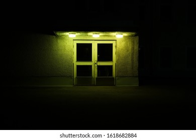 Creepy Asylum Door At Night With Green Lightning