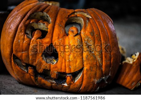 Creepy decaying carved pumpkin / haloween concept
