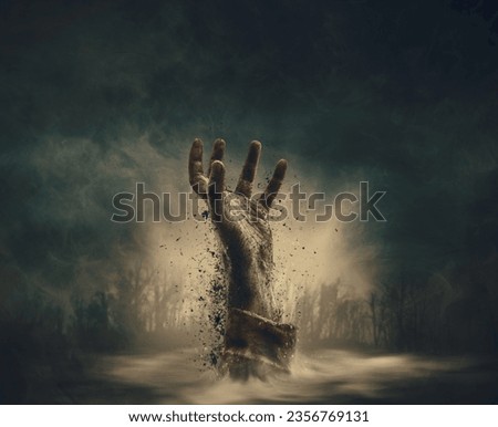 Creepy dirty zombie hand rising in the night sky surrounded by fog, horror and Halloween concept