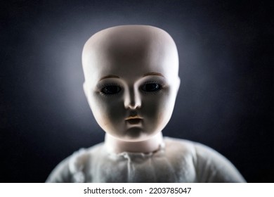 Creepy Doll Face On Dark Background