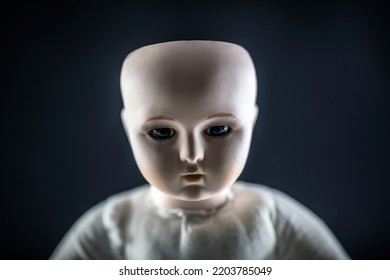 Creepy Doll Face On Dark Background