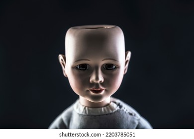 Creepy Doll Face On Dark Background