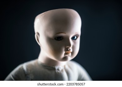 Creepy Doll Face On Dark Background