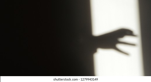 Creepy Hand In The Shadows