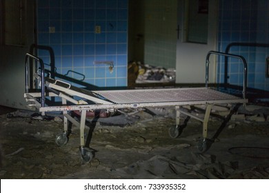 A Creepy Old Hospital Bed In A Dark, Dingy Abandoned Insane Asylum.