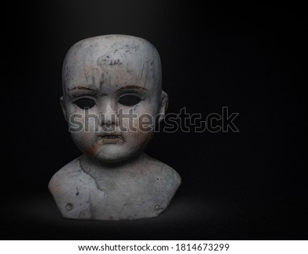 Creepy porcelain baby doll head found in the ruins of a burned down house