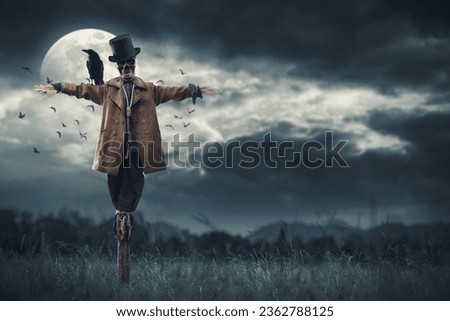 Creepy scarecrow with crow on his shoulder and full moon in the night sky, horror and Halloween concept