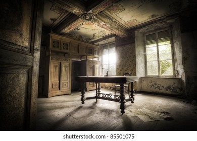 A creepy scenery, this old table creating a moody atmosphere along with the magnificent light.