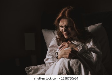 Creepy Smiling Woman In Nightgown Sitting In Bed