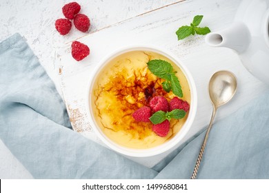 Crema Catalana, Spanish Dessert With Berries And Mint In White Ramekin, Top View, Fodmap Recipe