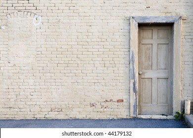 Creme Brick Wall With Door Background