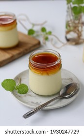 Creme Brulee Or Crème Brûlée No Bake Served In A Jar With Selective Focus. White Background 