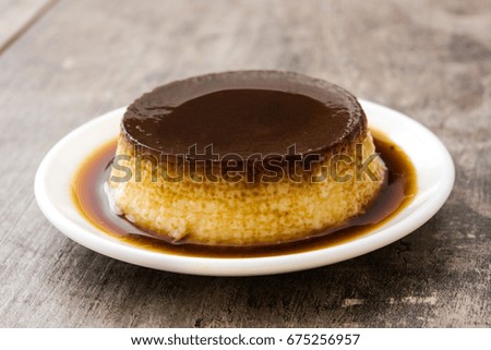 Similar – Creme caramel. Egg pudding on wooden background