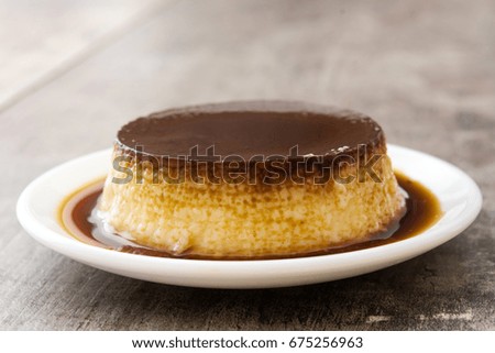 Similar – Creme caramel. Egg pudding on wooden background