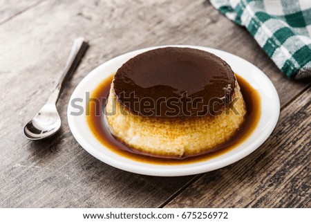 Similar – Creme caramel. Egg pudding on wooden background