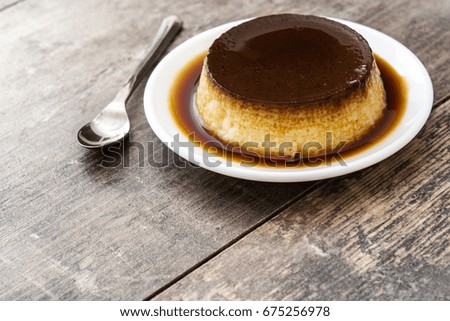 Similar – Creme caramel. Egg pudding on wooden background