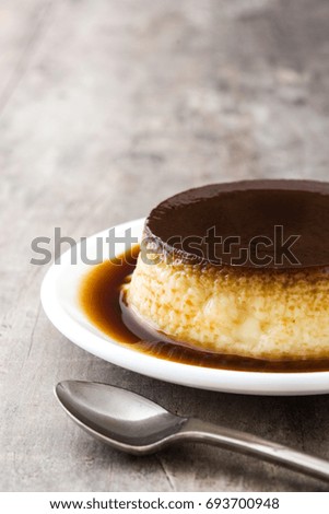 Similar – Creme caramel. Egg pudding on wooden background